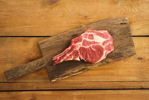 Dry aged Rib eye steak on wooden board
