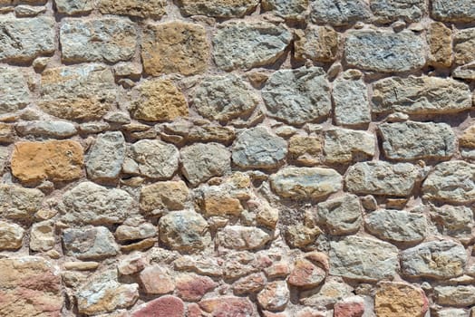 Background of a brown natural stone wall