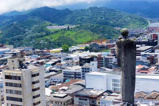 Statue on the basilica overlooking the city of Manizales, Colombia