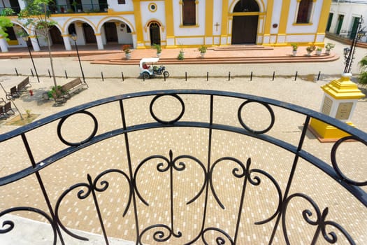 Iron railing overlooking a colonial plaza in Mompox, Colombia