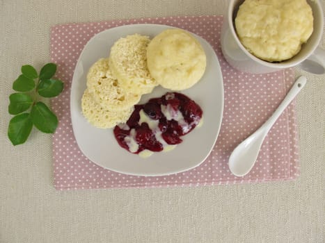 Homemade cup dumplings from the microwave with red groats and vanilla sauce