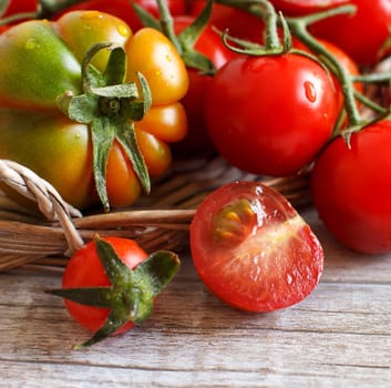 Fresh tomatoes on a wooden table close up