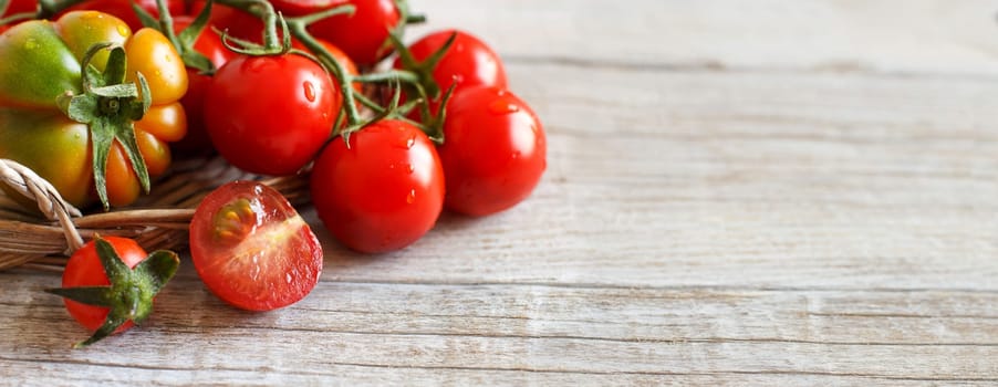 Fresh tomatoes on a wooden table close up