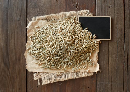Pile of Dry Raw Rye Grain with a small chalkboard