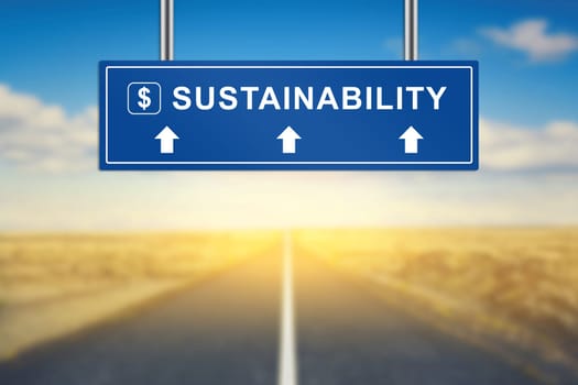 sustainability words on blue road sign with blurred background
