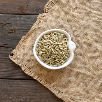Dry Raw Rye Grain in a bowl top view