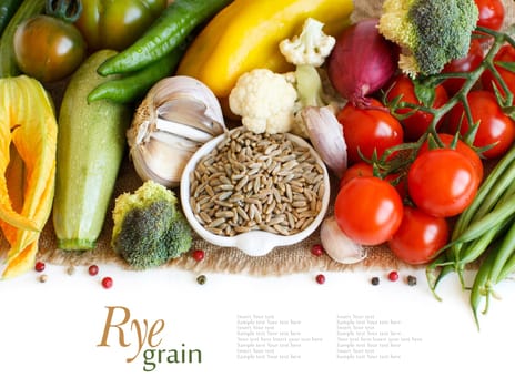 Raw Rye Grain in a bowl and vegetables isolated on white
