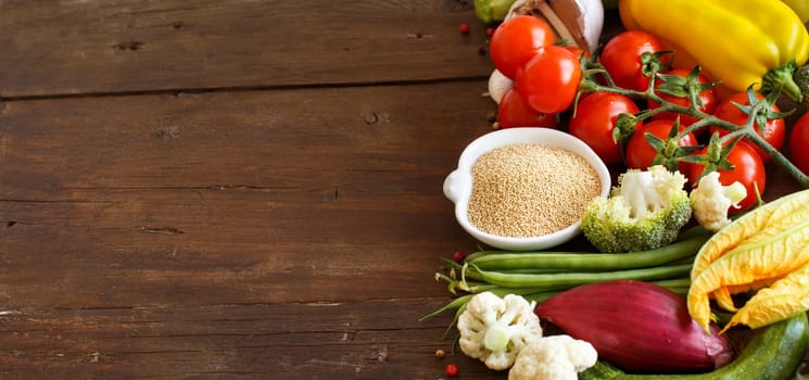 Raw Amaranth Grain in a bowl and vegetables isolated on white