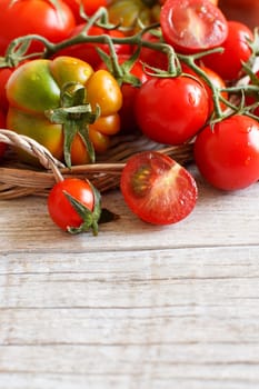 Fresh tomatoes on a wooden table close up