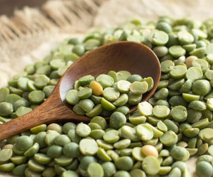 Dried Green Split Peas with a spoon close up