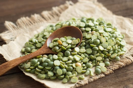 Dried Green Split Peas with a spoon close up