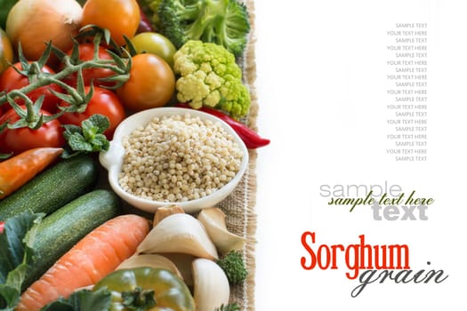 White sorghum grain in a bowl with vegetables isolated on white