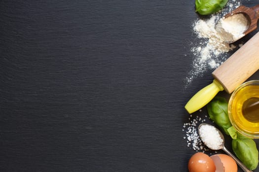 Ingredients of italian cuisine: tomatoes, olive oil, basil, eggs, flour, salt