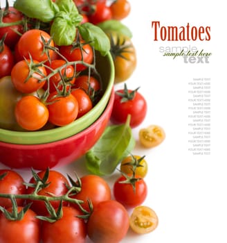 Cherry tomatoes and basil in bowl isolated on white background