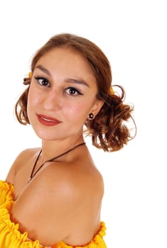 A profile portrait of a gorgeous young woman in a yellow blouse with.brunette hair, isolated for white background..