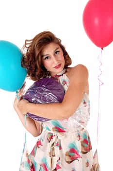 A gorgeous young woman with a big lollipop and balloons standing.waist up isolated for white background,.