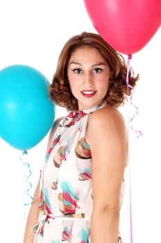 A very pretty young woman standing in a summer dress and holding.two balloons, isolated for white background..
