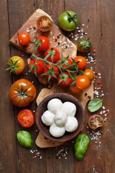 Italian cooking ingridients : mozzarella, tomatoes, basil, olive oil and other