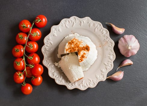 Italian ricotta cheese, garlic and cherry tomatoes top view