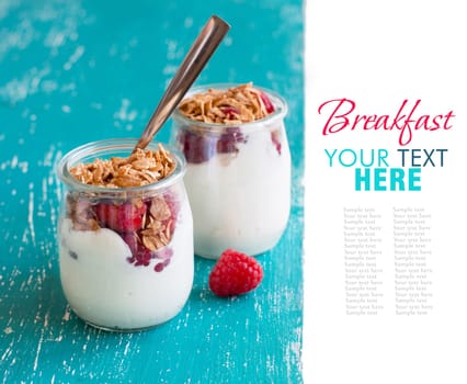 Raspberries, flakes and fresh yogurt in a jar