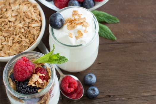Healthy breakfast with Fresh greek yogurt, flakes and berries