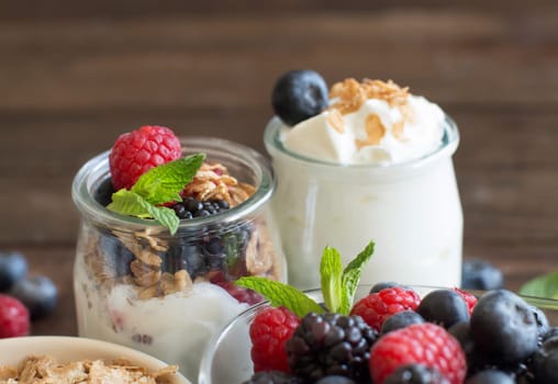 Healthy breakfast with Fresh greek yogurt, muesli and berries