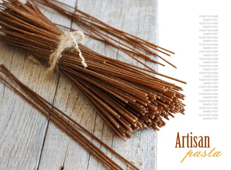 Italian spaghetti on the old wooden table close up