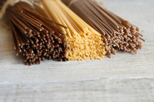 Italian spaghetti on the old wooden table close up