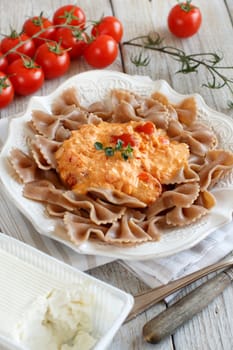 Wholegrain Pasta with stracchino cheese and fresh tomatoes
