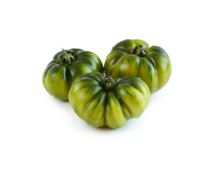 Fresh green costoluto tomatoes isolated on white background