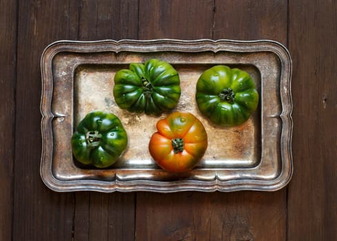 Costoluto tomatoes on a metal tray top view