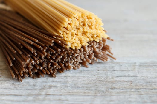Italian spaghetti on the old wooden table close up