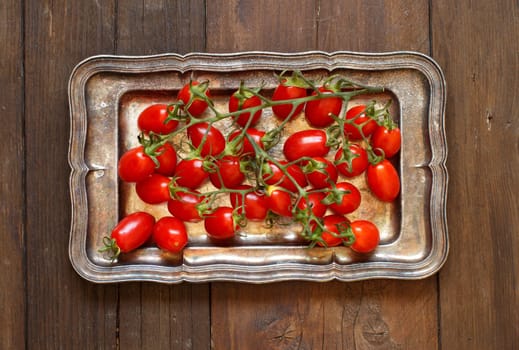 Cherry tomatoes on a metal tray top view