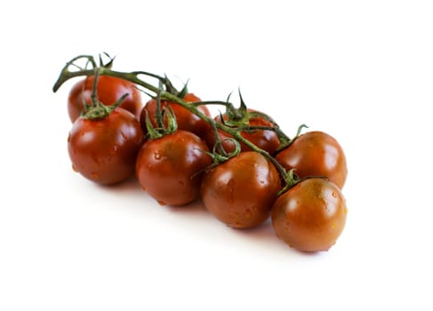 Fresh black cherry tomatoes isolated on white background