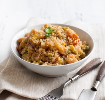 Cooked Quinoa with vegetables and shrimps in a bowl
