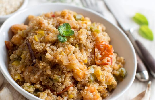 Cooked Quinoa with vegetables and shrimps in a bowl