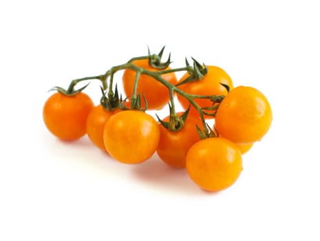 Fresh yellow cherry tomatoes isolated on white background