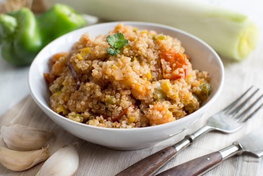Cooked Quinoa with vegetables and shrimps in a bowl