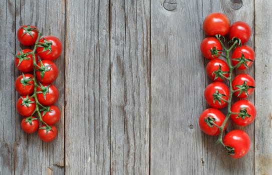 Cherry tomatoes on a wooden table background