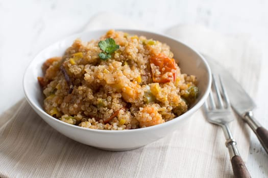 Cooked Quinoa with vegetables and shrimps in a bowl