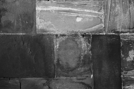 The close-up of the surface and texture of a wall of striking stones.