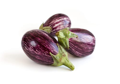 Three Fresh Raw striped eggplants isolated on white