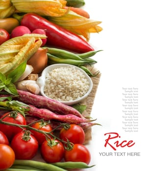 White rice in bowl and fresh vegetables isolated on white