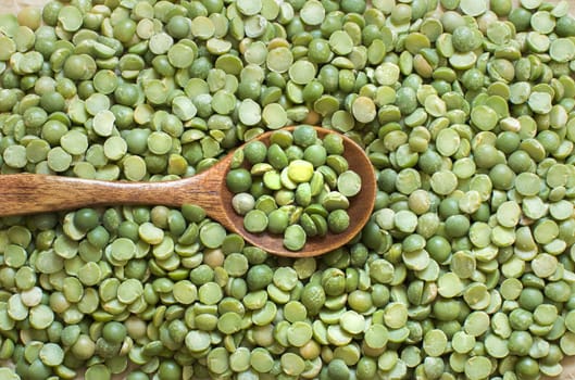 Dried Green Split Peas with a spoon close up