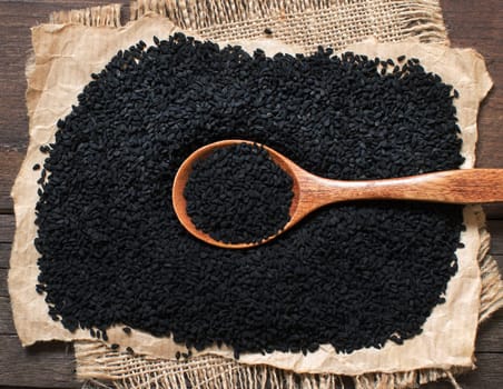 Nigella sativa or Black cumin with a spoon top view