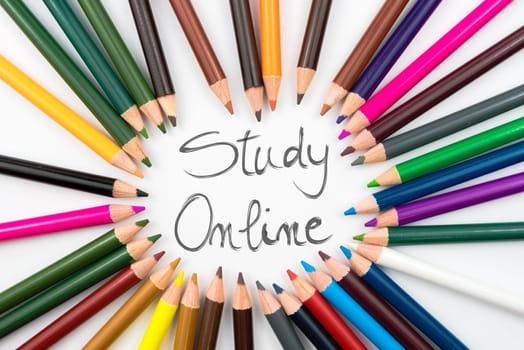 Colouring pencils in circle arrangement with message Study Online, education concept