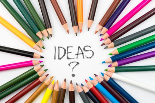 Colouring pencils in circle arrangement with message IDEAS ?, education concept
