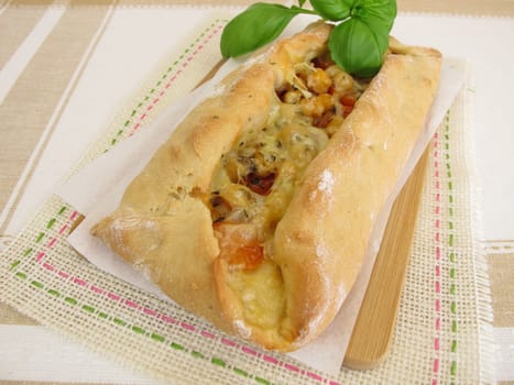Stuffed pide bread with tomatoes,chickpeas and cheese