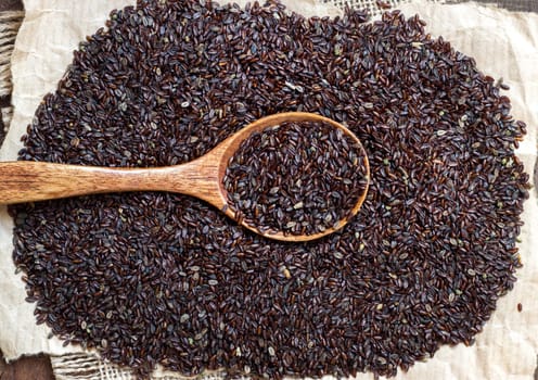 Psyllium seeds with a spoon on a craft paper