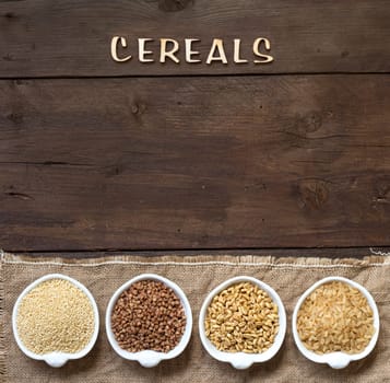 Cereals in bowls border with word Cereals on wood
